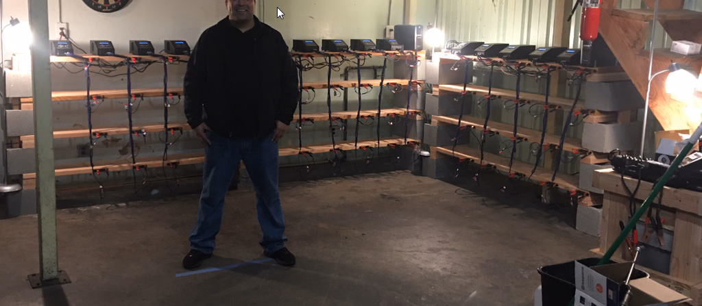 Empty ReVolt AuGoose reconditioning shelves installed inside a smog shop